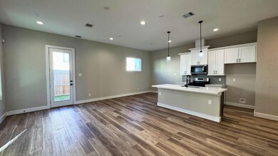 Open concept on the first floor opens the kitchen