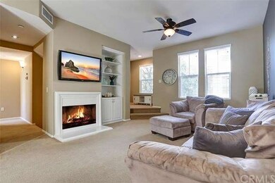 Cozy fireplace is the focal point of this great fa