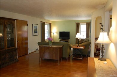 Spacious living room with hardwood floors.