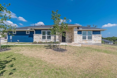 View of front of home featuring stone siding