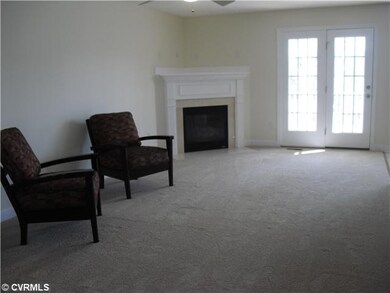 Living Room - Ceiling Fan and door to covered deck