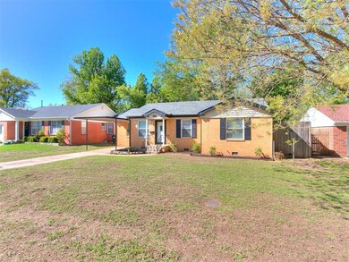 Ranch-style house with a front lawn