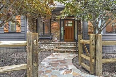 Gate welcomes you to the stone front porch.