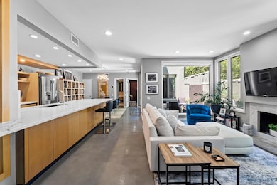 Living area with a high end fireplace, finished c