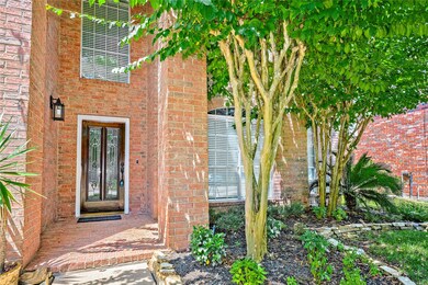 Lovely entry way with lush greenery & ring doorbel