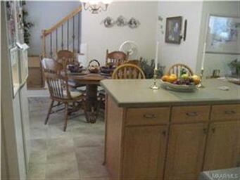 Eat-in nook and stairs up to loft/study/office and