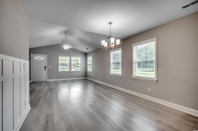 Empty room featuring light hardwood / wood-style f