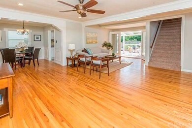 Living room with french doors open to the back yar