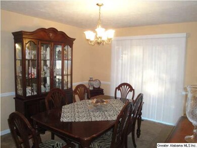 Formal dining room with French doors leading to th