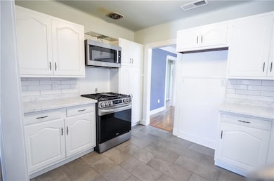 Nice clean kitchen with gas stove