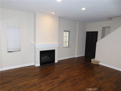 Living Room with Gas Burning Fire Place and New Laminate Flooring
