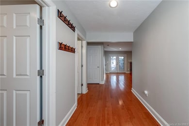 Once you open the front door you are greeted with hardwood floors and a nice foyer.