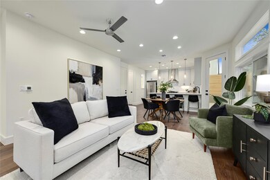 Living area with recessed lighting, ceiling fan, 