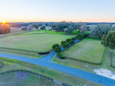 Turn off the [rivate rtoad and follow the tree-lined driveway that leads up to the residence.