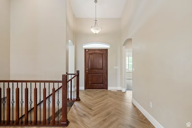 Foyer featuring a towering ceiling and arched walkways