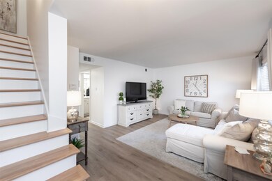 Living room featuring light hardwood / wood-style 