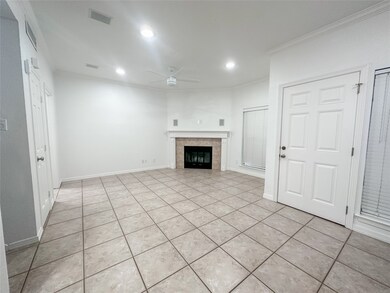 Large windows flood the living room with natural light, creating a warm and welcoming atmosphere.