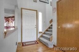 Front door access to upstairs, clothes closet,