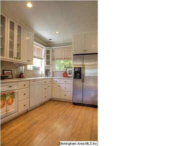 Gorgeous kitchen with hardwoods, breakfast bar, an