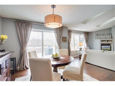 Glass doors off the dining area lead to the deck &
