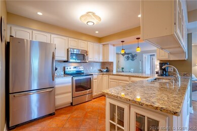 Updated kitchen with granite countertops and stain