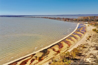 Photo shows miles of sandy shoreline; Hwy 69 Bridg