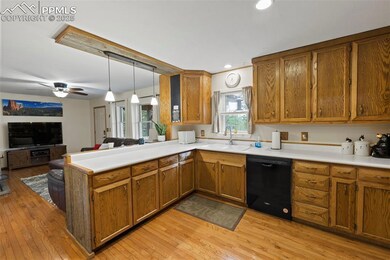 Charming and efficient, the kitchen includes natural wood cabinetry, solid-surface counters, and all appliances—ready for whatever the day brings.