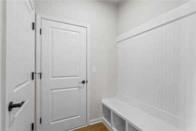 Mudroom with light hardwood / wood-style flooring*