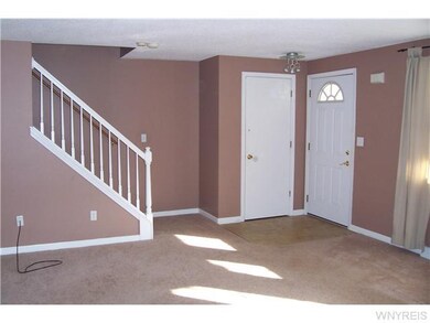 Living Room warm earth tones ans updated carpet in