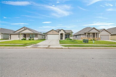 View of front of property featuring concrete drive