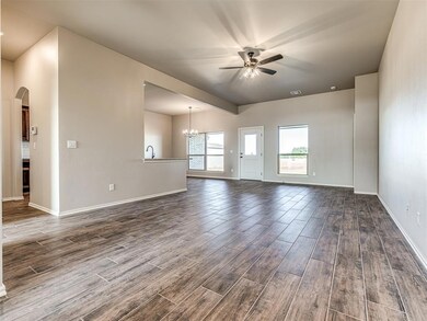 As you enter w/ a view of the large living room th