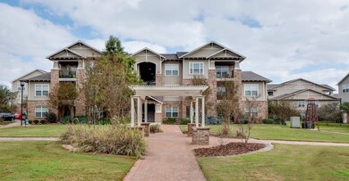 View of front of property with a pergola, a front