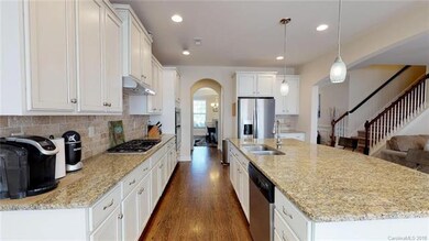 Archway leads to formal dining room and includes a