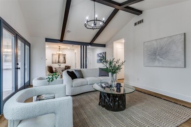 Living area featuring lofted ceiling with beams, w