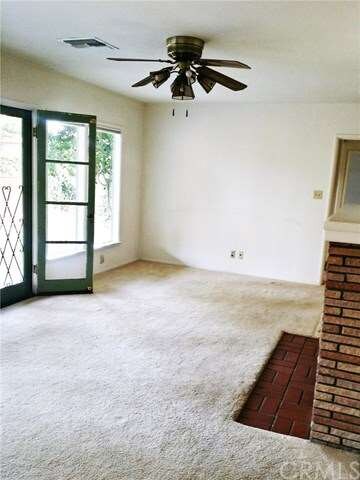 The Family room, has features a wall of windows , 