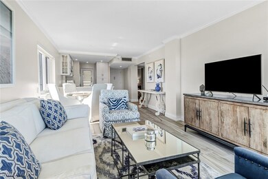 Living room with light hardwood / wood-style floor