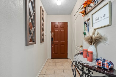Welcoming foyer, side door leads to the double garage.