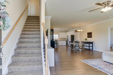 LVP carries through the family room, dining area, kitchen, hall, laundry and powder room on the 1st level