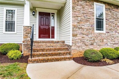 Freshly painted front door and beautiful stone facing.