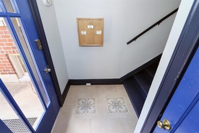 Freshly painted common area with new tile flooring