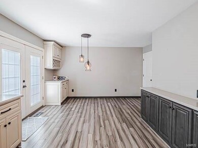 French doors lead to large deck, wine bar area, an