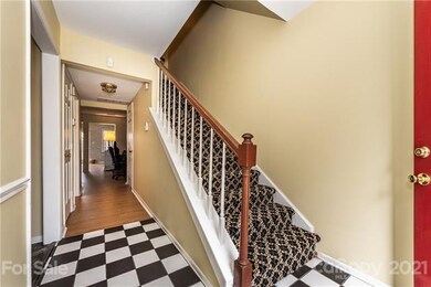 Front foyer, staircase and hallway to living room 