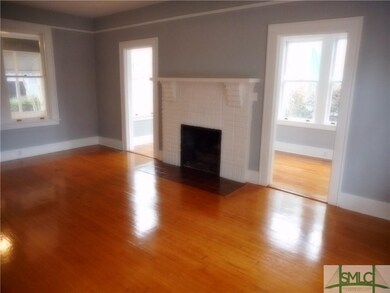 Living room with working gas fire place, sunroom t