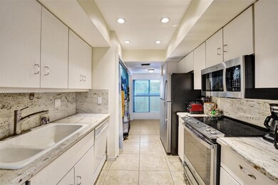 Galley Kitchen with dine in or office option in the back.