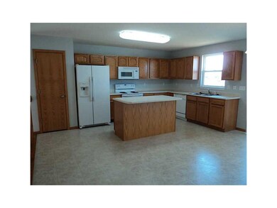 Kitchen. Oversize kitchen/dining area with oak fin