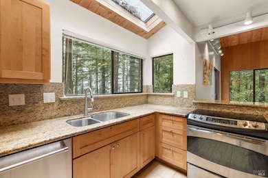Kitchen with pockets of an ocean view.