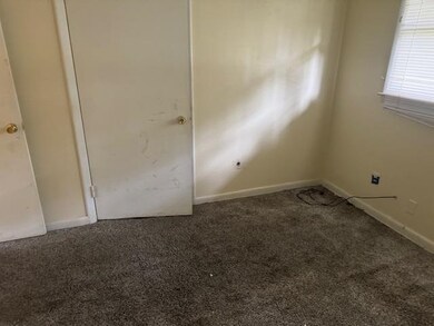 Empty room with carpet floors