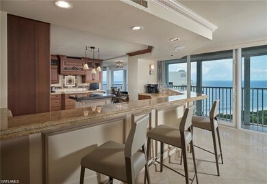 Kitchen with plenty of natural light, pendant lighting, kitchen peninsula, and light tile patterned floors
