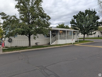 Manufactured / mobile home with a porch and stairs