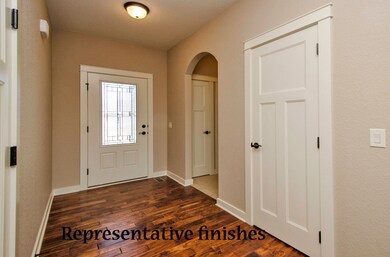 Spacious entry, hardwood floor.